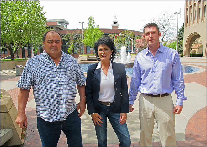 In this Thursday, May 8, 2014 photo, from left, Larry Harvey, Rhonda Firestack-Harvey, and Rolland Gregg stand in the plaza in front of the federal courthouse in Spokane, Wash. The three are charged with growing marijuana at a remote farm near Kettle Falls, Wash. Each face mandatory minimum sentences of at least 10 years in prison after they were caught growing about 70 pot plants on their rural, mountainous property. Medical marijuana advocates have cried foul, arguing the prosecution violates Department of Justice policies announced by Attorney General Eric Holder last year that nonviolent, small-time drug offenders shouldn't face lengthy prison sentences. (AP Photo/Nicholas K. Geranios)